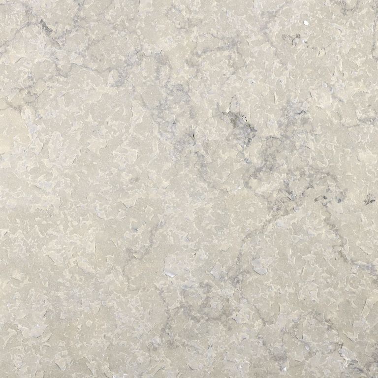 Color/Finish variation image for Sky Prima Limestone - Veneer. The surface finish shown is flamed. Dominant colors shown are beige, gray and cream; with white and tan secondaries. Exhibits 