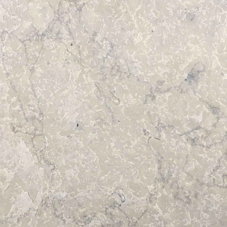 Swatch image cropped for Sky Prima Limestone - Veneer. The surface finishes shown are brushed and flamed. Dominant colors shown are beige, gray and cream; with pink, white and tan secondaries. Exhibits 
