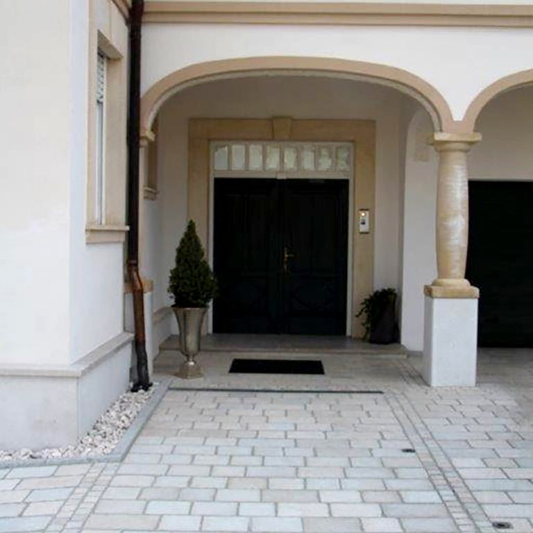 The image shows this product being used in a path pavers application.