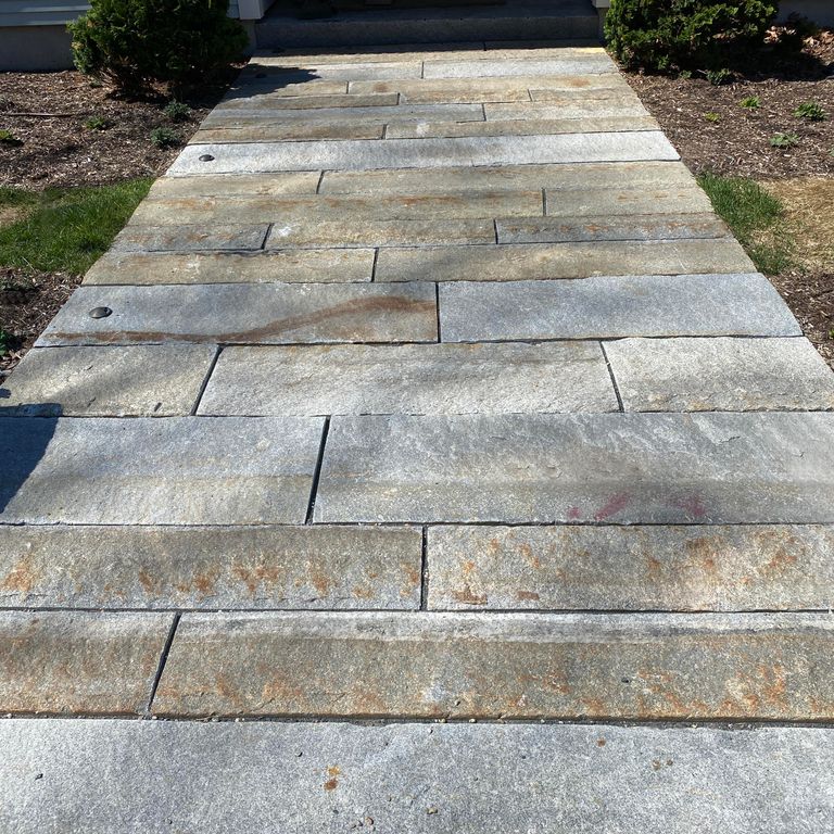 The image shows this product being used in a path pavers application.