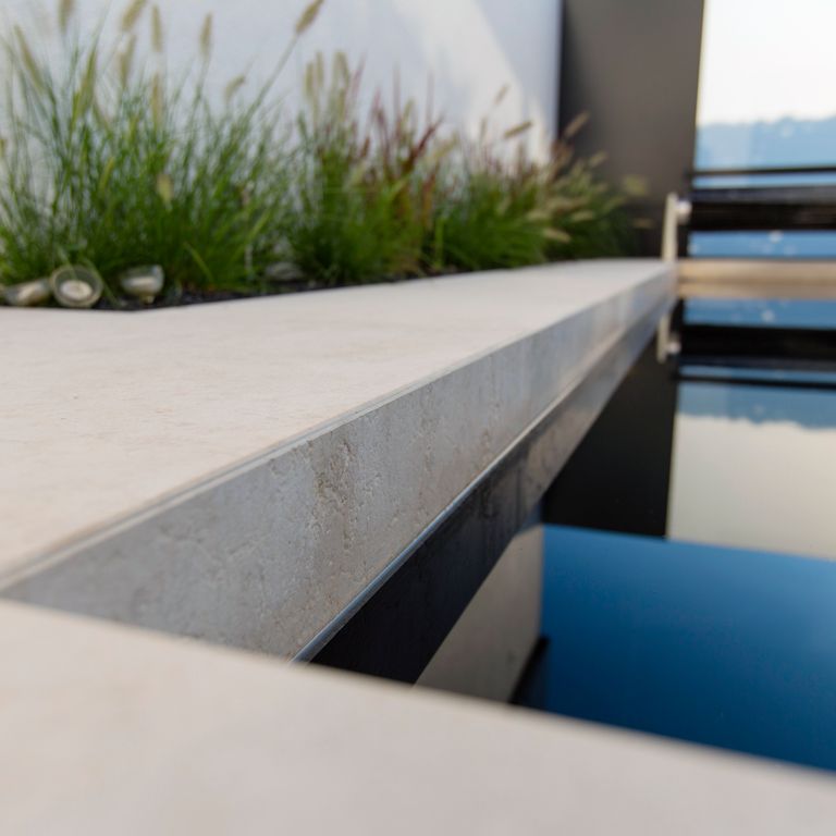 The image shows this product being used for Limestone- Mountain Hard Beige - Pool Coping.