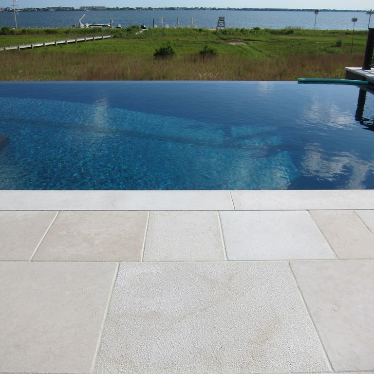 The image shows this product being used for Limestone- Mountain Hard Beige - Pool Coping.