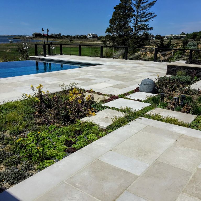 Application image for Limestone - Mountain Hard Beige - Pool Coping. The image shows this product being used for pool coping and patio pavers. Dominant colors shown are beige and tan. The color mix creates a warm feeling.