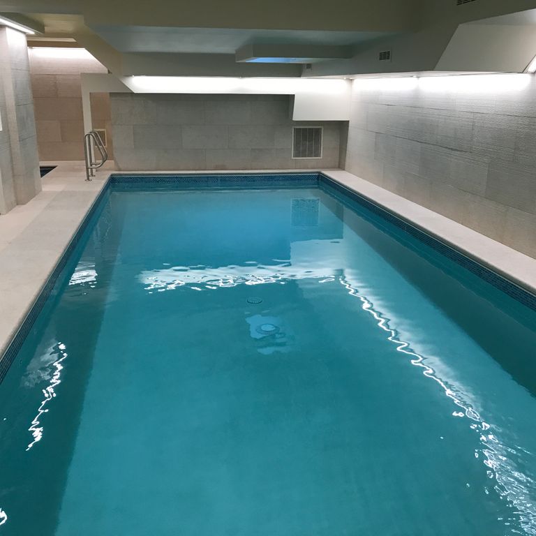 Application image for Limestone - Mountain Hard Beige - Pool Coping. The image shows this product being used for pool coping and pool deck pavers. The dominant color shown is beige.