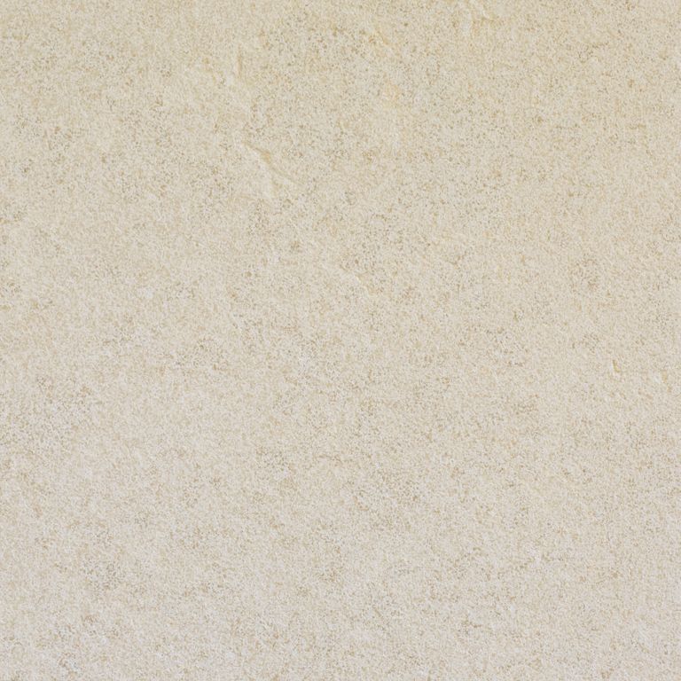 Swatch image cropped for Mountain Hard Limestone Beige - Countertop Slabs. The surface finish shown is sand blasted. Dominant colors shown are beige and cream; with gray, white and tan secondaries. The color mix creates a warm feeling. Solid and fine speckled color patterns.