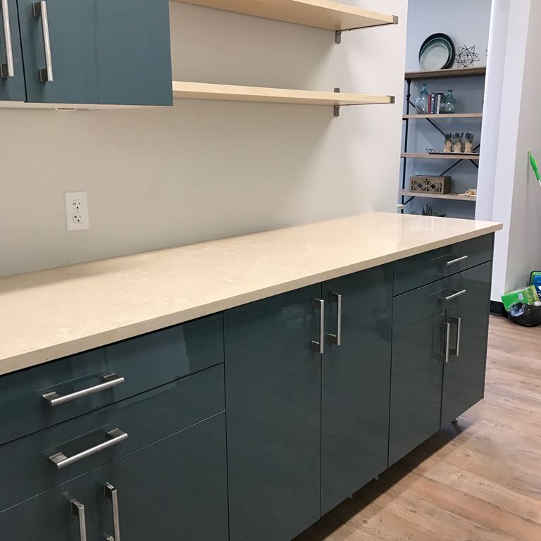 Feature image for Mountain Hard Limestone Beige - Countertop Slabs. The image shows this product being used in a countertop slabs application. Dominant colors shown are beige, tan and cream. Exhibits 