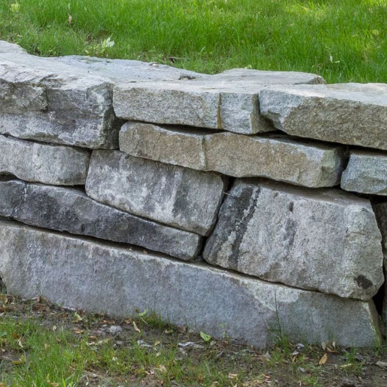The image shows this product being used in a landscape wallstone application.