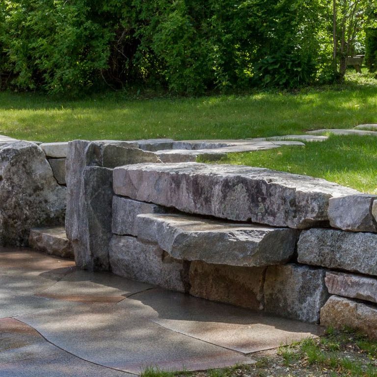 The image shows this product being used in a landscape wallstone application.