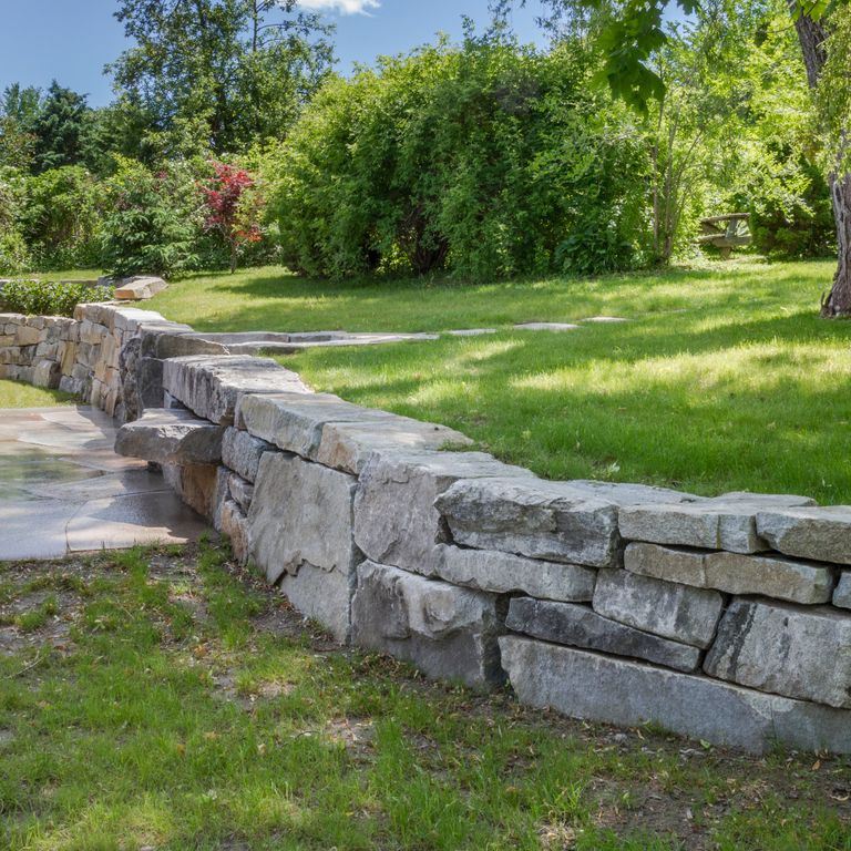 The image shows this product being used in a landscape wallstone application.