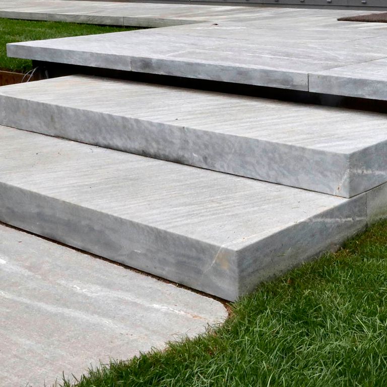 Close-up image for Granite- Mystic Mountain- Steps. The surface finish shown is flamed. The dominant color shown is gray; with beige, pink, purple and white secondaries. Exhibits 