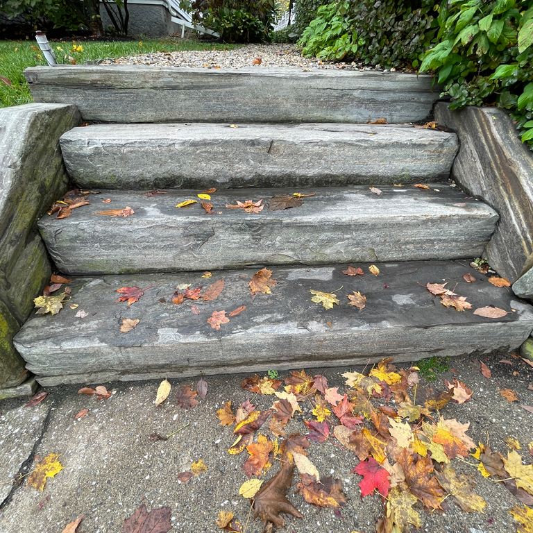 Application image for Granite- Mystic Mountain- Steps. The image shows this product being used in a monolithic steps application. The surface finish shown is flamed. The dominant color shown is gray; with green and white secondaries. Exhibits 