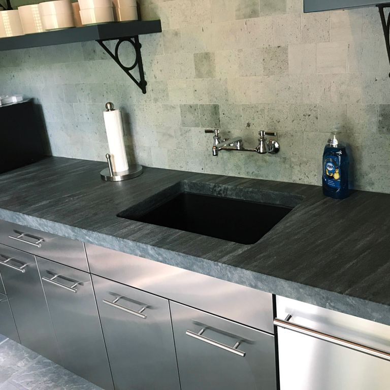 Application image for Mystic Mountain Countertops. The image shows this product being used in a countertop slabs application. This is a building and landscape stone for indoor and outdoor commercial and residential applications. Suitable for general use and freeze-thaw conditions situations. Higher to high on the price spectrum.