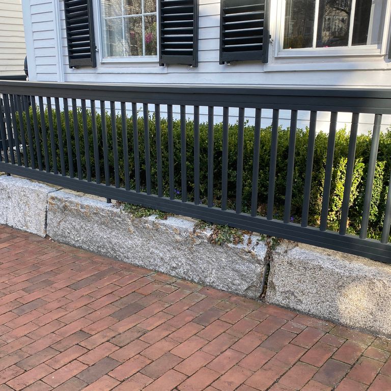 Application image for Granite - Reclaimed - Edging. The image shows this product being used in a landscape curbing & edging application. This is a landscape stone for outdoor commercial and residential applications. Suitable for general use, freeze-thaw conditions, low heat absorption surfaces and low slipperiness surfaces situations. Relatively moderate in price.
