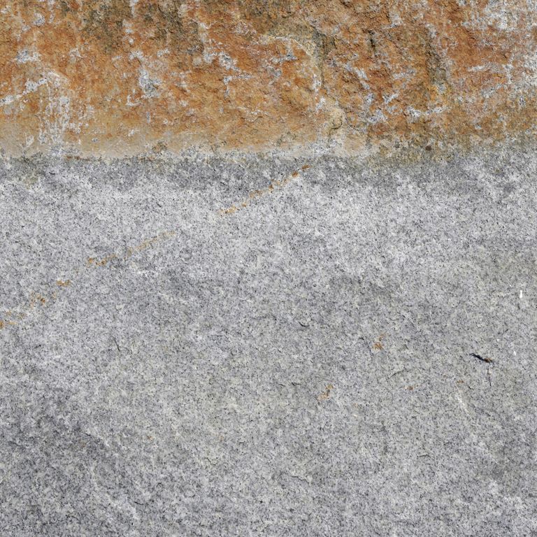Color/Finish variation image for Reclaimed Granite Curbstone - Junior Wallstone. The dominant color shown is gray; with beige, brown, orange/rust, white and tan secondaries. Fine speckled, blotched and cloudy color patterns.