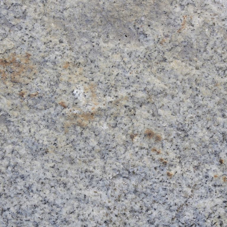 Color/Finish variation image for Reclaimed Granite Curbstone - Junior Wallstone. The dominant color shown is gray; with beige, blue, orange/rust and white secondaries. Speckled, blotched and cloudy color patterns.