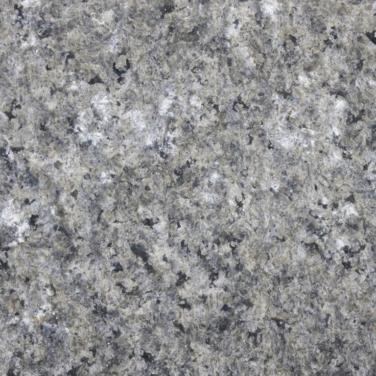 Color/Finish variation image for Reclaimed Granite Curbstone - Junior Wallstone. The dominant color shown is gray; with beige, green and white secondaries. The color mix creates a cool feeling. Coarse speckled color pattern.