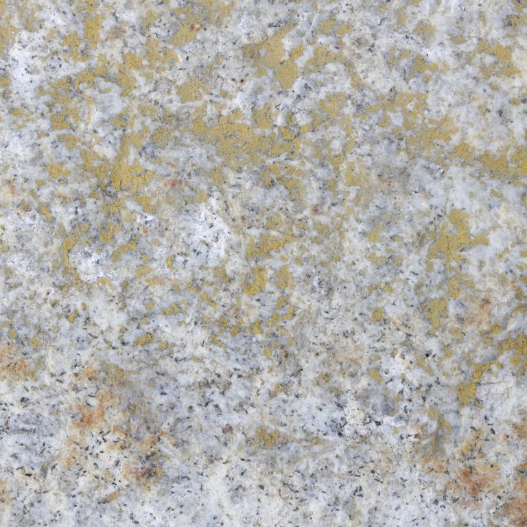 Color/Finish variation image for Reclaimed Granite Curbstone - Junior Wallstone. Dominant colors shown are gray and white; with brown, orange/rust and tan secondaries. The color mix creates a warm feeling. Speckled and blotched color patterns.