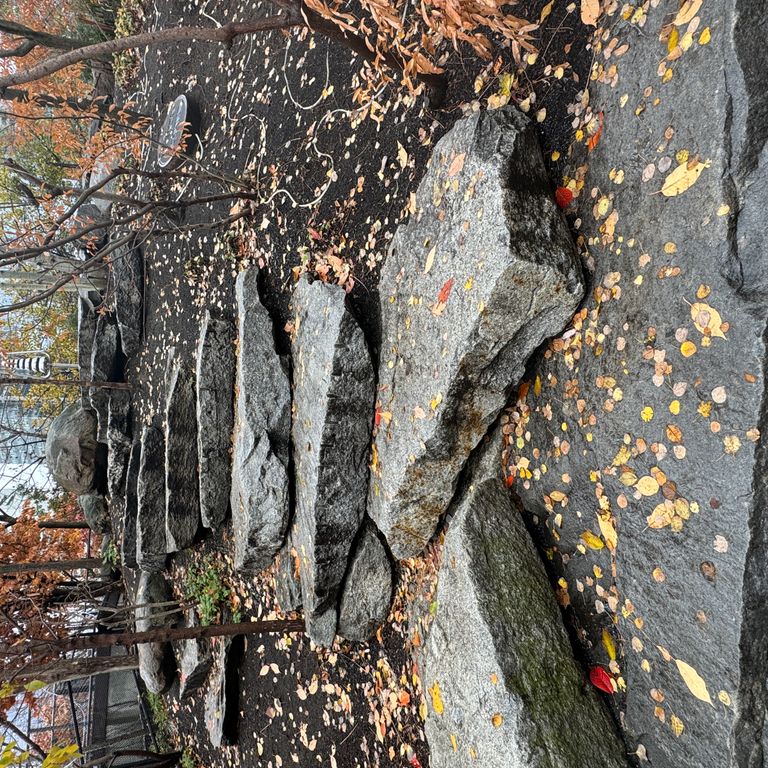 Application image for Granite - Reclaimed New England Quarry Tailings - Seating. The image shows this product being used for garden accents and seating & benches. The dominant color shown is gray.