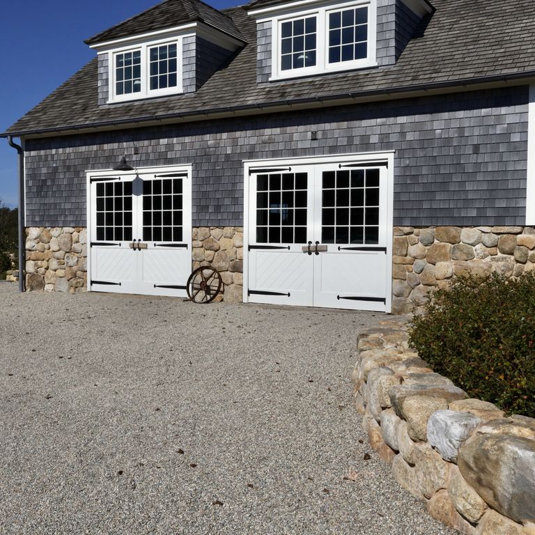 Application image for New England Fieldstone - Veneer. The image shows this product being used in a full bed veneer application. The surface finish shown is natural. Dominant colors shown are brown and tan; with beige, gray and orange/rust secondaries. The color mix creates a warm feeling.