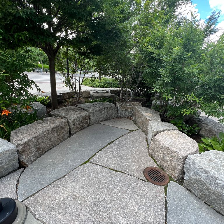 Application image for Granite - New England Mix - Live Edge Paver. The image shows this product being used for patio pavers and public area. Dominant colors shown are gray and white.