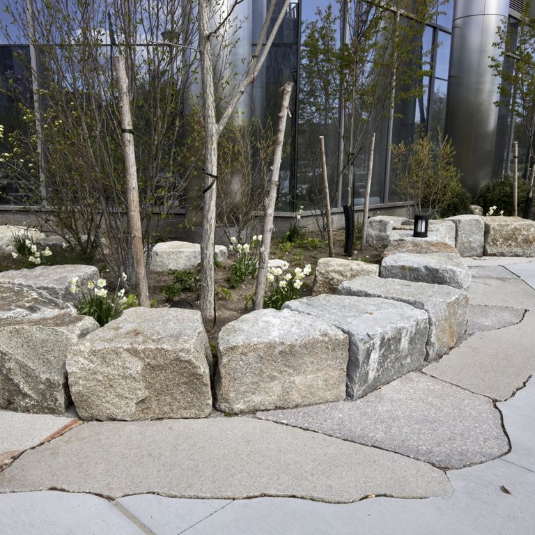 Application image for Granite - New England Mix - Live Edge Paver. The image shows this product being used for patio pavers and public area. The dominant color shown is gray.
