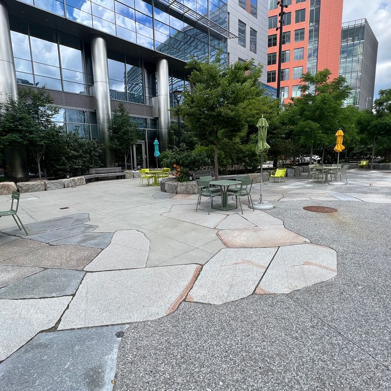 Application image for New England Granite Mix - Live Edge Paver. The image shows this product being used in a patio pavers application. The dominant color shown is gray.