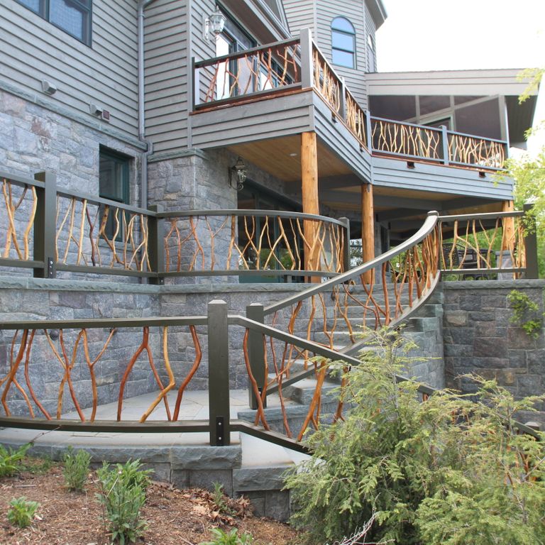 Feature image for Hawthorne Granite - Veneer. The image shows this product being used in a full bed veneer application. The dominant color shown is gray; with beige, blue, brown, orange/rust, purple, white and tan secondaries. Exhibits 