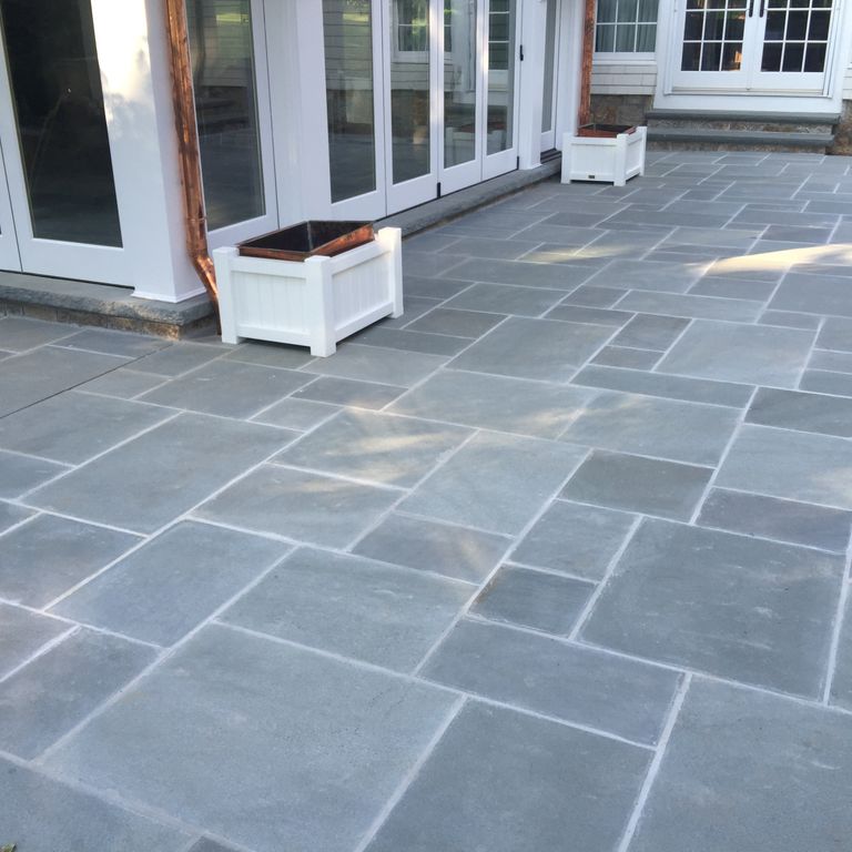The image shows this product being used in a patio pavers application.