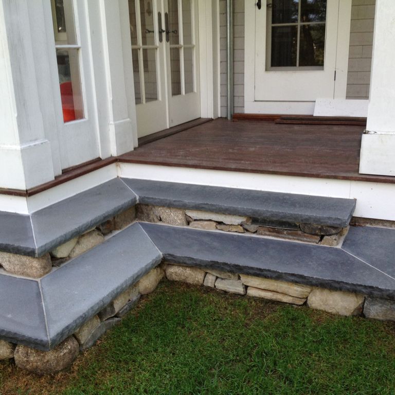 Feature image for Bluestone Flamed Surface Blue/Gray - Treads. The image shows this product being used in a treads application. Dominant colors shown are blue and gray; with a purple secondary. The color mix creates a cool feeling. Solid and cloudy color patterns.