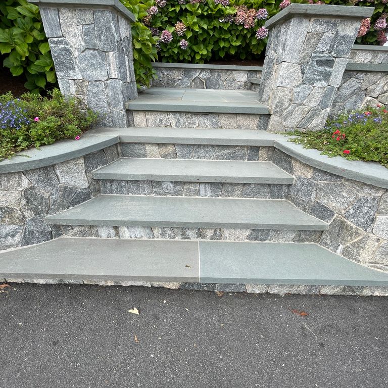 Application image for Bluestone Flamed Surface Blue/Gray - Treads. The image shows this product being used in a treads application. The surface finish shown is flamed. The dominant color shown is gray; with a blue secondary. The color mix creates a cool feeling.