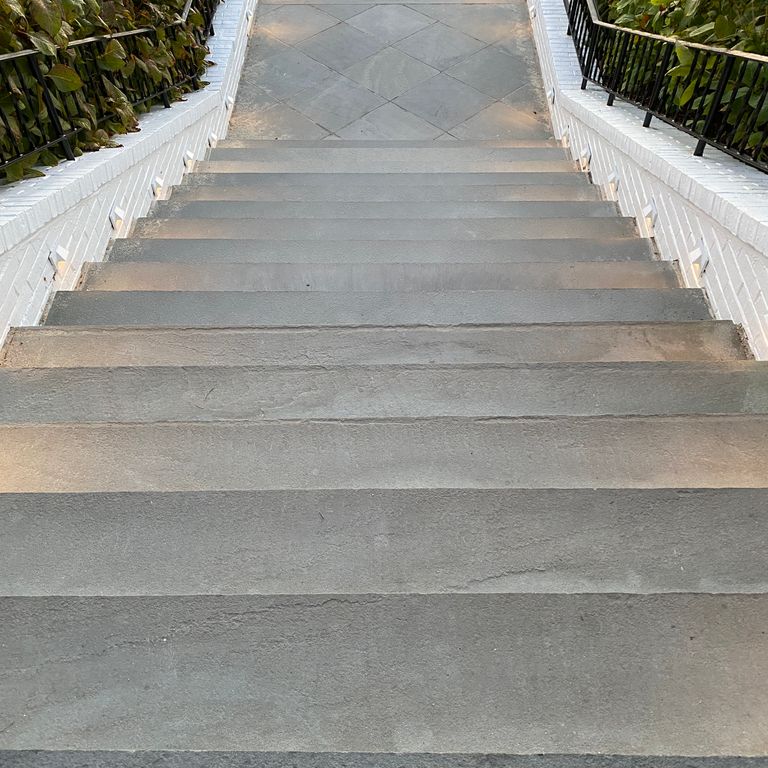 Application image for Bluestone Flamed Surface Blue/Gray - Treads. The image shows this product being used in a treads application. This is a landscape stone for indoor and outdoor commercial and residential applications. Suitable for general use, freeze-thaw conditions, high traffic areas, low slipperiness surfaces and high heel compatibilty situations. Low to moderate on the price spectrum.