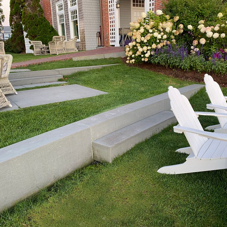 Application image for Blue/Gray Bluestone - Flamed Monolithic Steps. The image shows this product being used in a monolithic steps application. The surface finish shown is flamed. The dominant color shown is gray. The color mix creates a warm feeling.