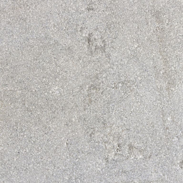 Color/Finish variation image for Limestone- Portuguese Dawn Haze - Pool Coping. The surface finish shown is sand blasted. The dominant color shown is gray; with beige, pink, white and cream secondaries. The color mix creates a cool feeling. Fine speckled and cloudy color patterns.