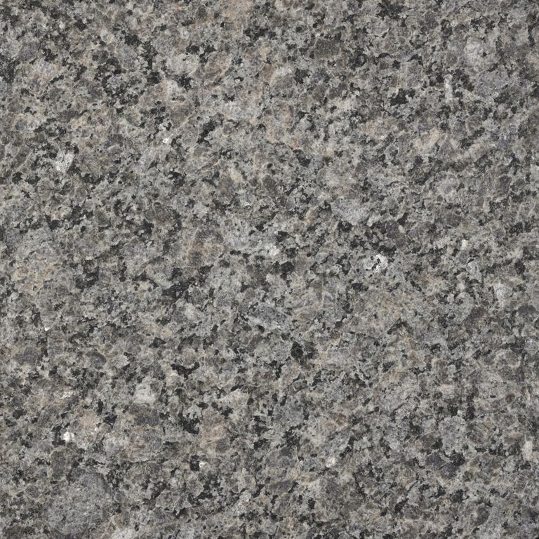 Swatch image cropped for Caledonia Granite - Monolithic Steps. The surface finish shown is flamed. The dominant color shown is gray; with brown, green and purple secondaries. Exhibits 