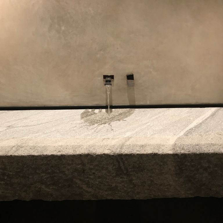 Application image for Reclaimed Granite Sinks. The image shows this product being used in a sinks application. Suitable for general use, freeze-thaw conditions, low heat absorption surfaces and low slipperiness surfaces situations. Moderate to higher on the price spectrum.