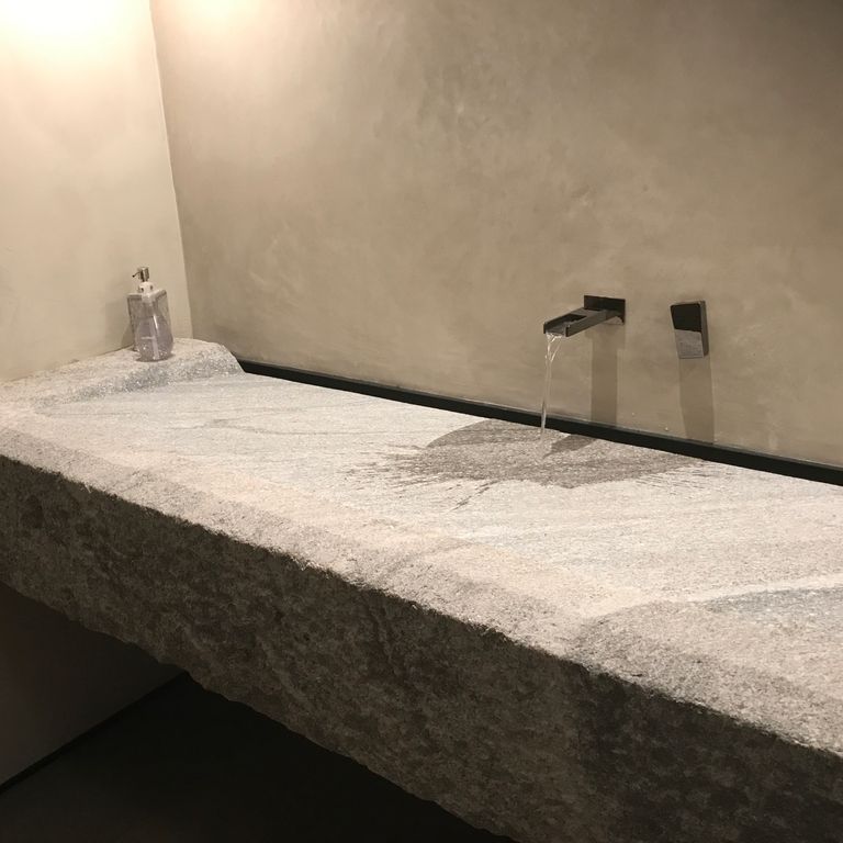 Application image for Reclaimed Granite Sinks. The image shows this product being used in a sinks application. Suitable for general use, freeze-thaw conditions, low heat absorption surfaces and low slipperiness surfaces situations. Moderate to higher on the price spectrum.
