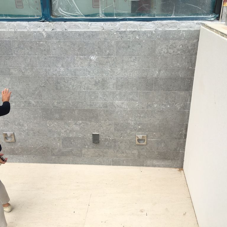 Application image for Portuguese Dawn Haze Limestone - Veneer. The image shows this product being used in a thin veneer application. The dominant color shown is gray.