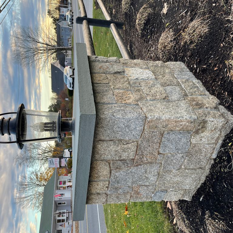 Application image for Cape Neddick Clear Granite - Full Bed Veneer. The image shows this product being used for posts and full bed veneer. The dominant color shown is gray. The color mix creates a warm feeling.
