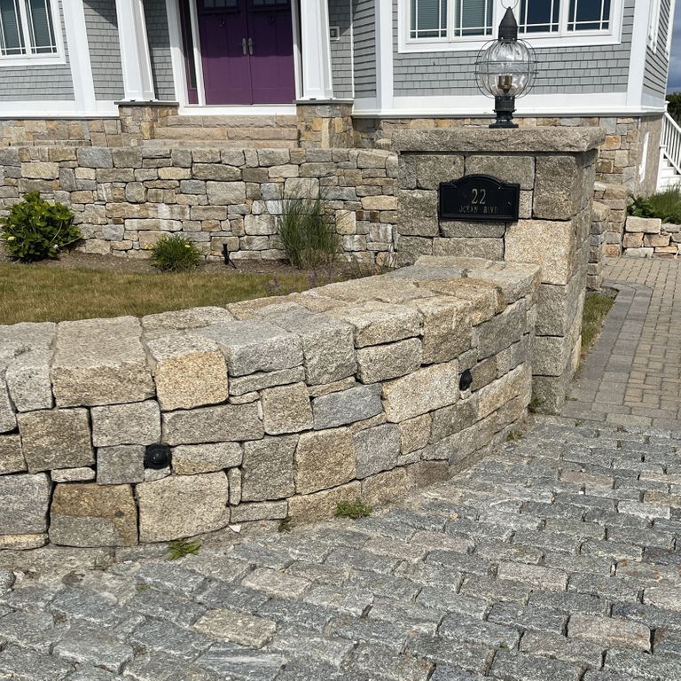 Application image for Cape Neddick Granite Clear - Full Bed Veneer. The image shows this product being used in a full bed veneer application. Dominant colors shown are beige, gray and tan. Speckled color pattern.