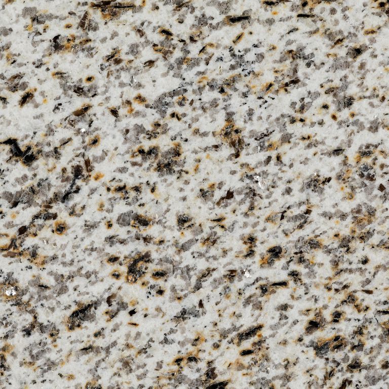 Color/Finish variation image for Masterpiece Yellow Granite - Full Bed Veneer. The surface finishes shown are flamed, polished and sand blasted. Dominant colors shown are beige, gray and white; with brown, orange/rust and cream secondaries. The color mix creates a warm feeling. Coarse speckled color pattern.