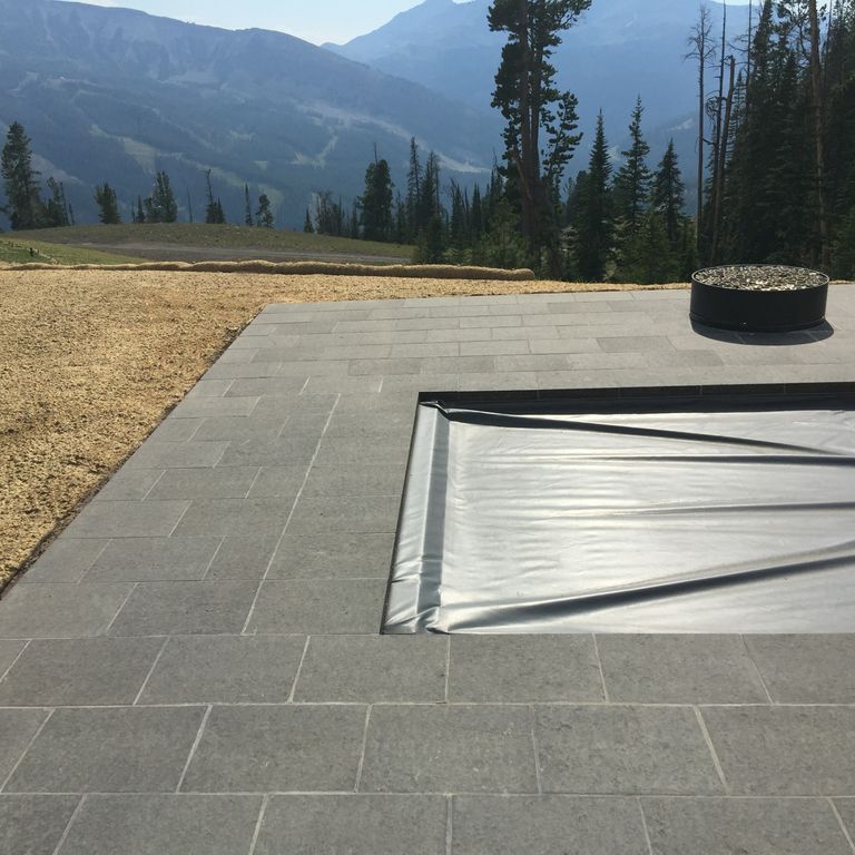 Application image for Basalt - Nordic Black - Dimensional Cut Pavers. The image shows this product being used in a patio pavers application. Dominant colors shown are black and gray.
