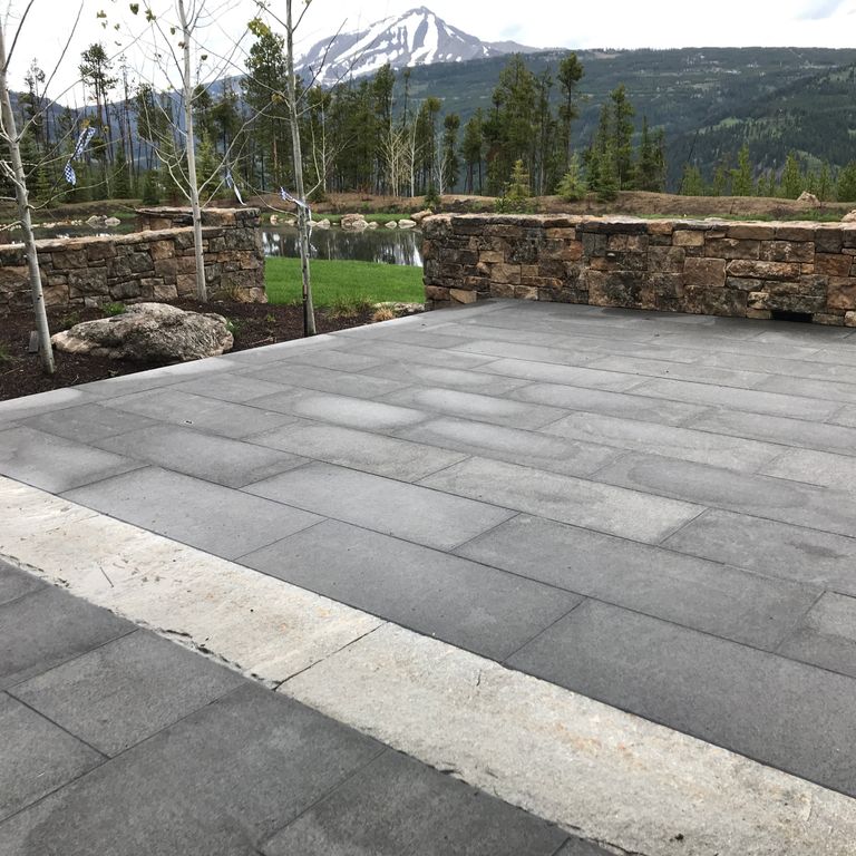 Application image for Basalt - Nordic Black - Dimensional Cut Pavers. The image shows this product being used in a patio pavers application. The dominant color shown is gray.