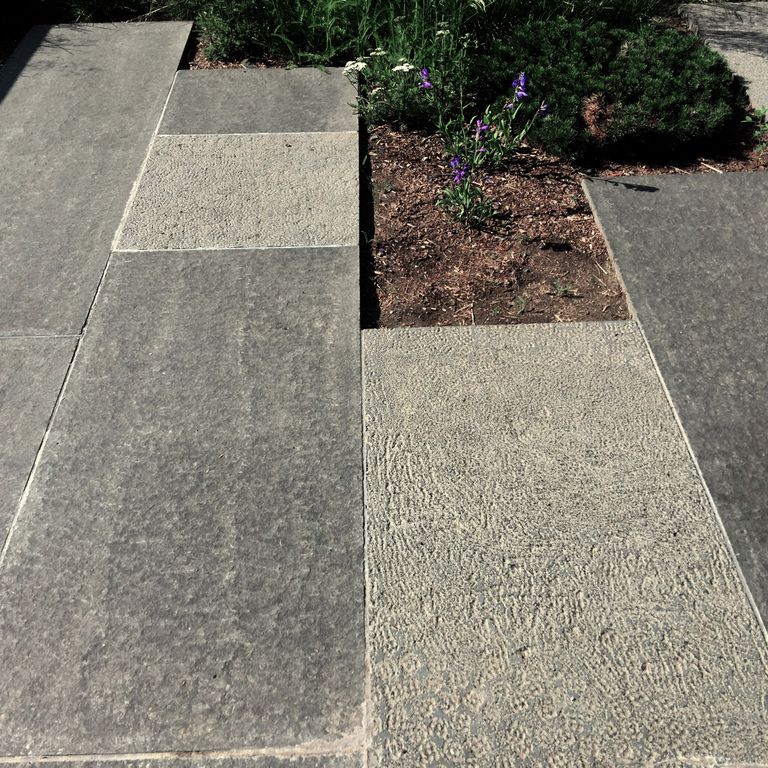 The image shows this product being used in a patio pavers application.