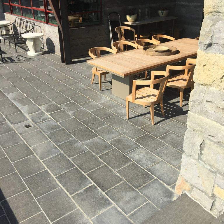 Application image for Basalt - Nordic Black - Dimensional Cut Pavers. The image shows this product being used in a patio pavers application. The dominant color shown is gray.