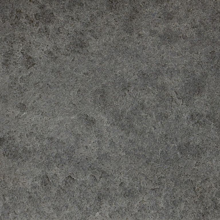 Swatch image for Ankar Black Basalt - Cobblestones. The surface finish shown is a combination of brushed and flamed. The dominant color shown is gray; with black, brown, green and purple secondaries. The color mix creates a cool feeling. Regular color pattern.
