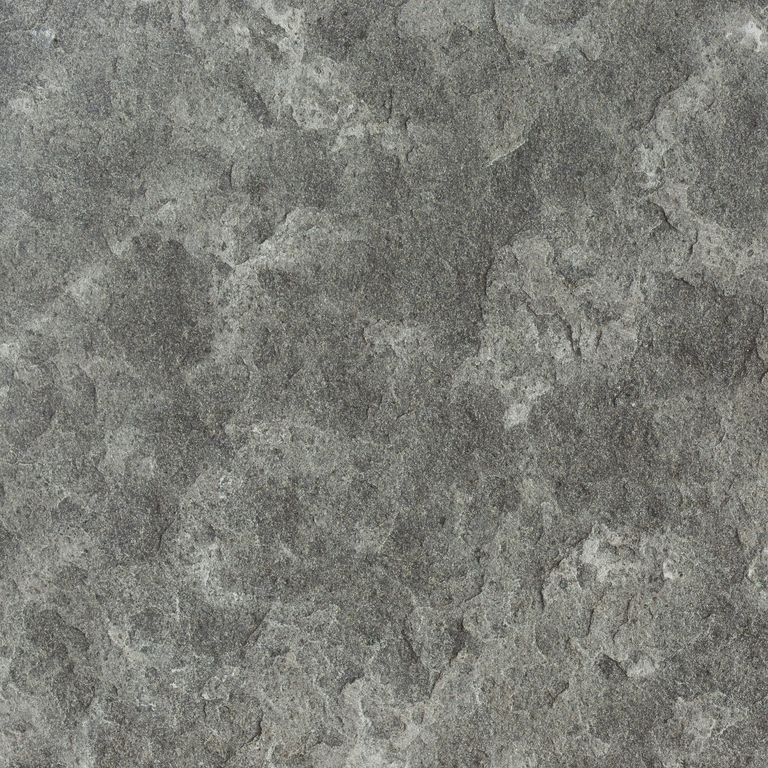 Swatch image cropped for Nordic Black Basalt - Monolithic Steps. The surface finish shown is flamed. Dominant colors shown are green and gray; with a brown secondary. Exhibits 