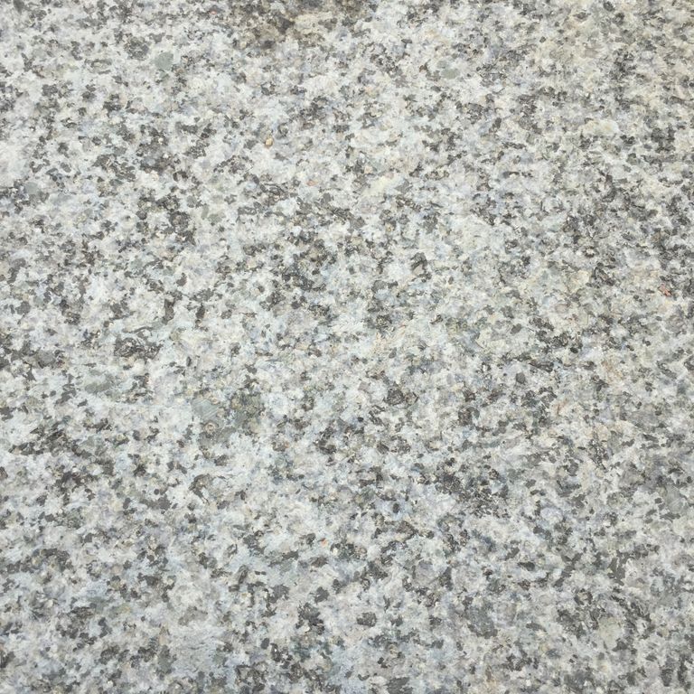 Color/Finish variation image for Granite Plank Pavers - Antiqued Surface. The dominant color shown is gray; with beige, white and cream secondaries. The color mix creates a cool feeling. Speckled and coarse speckled color patterns. Contains some mica and mineral inclusions.