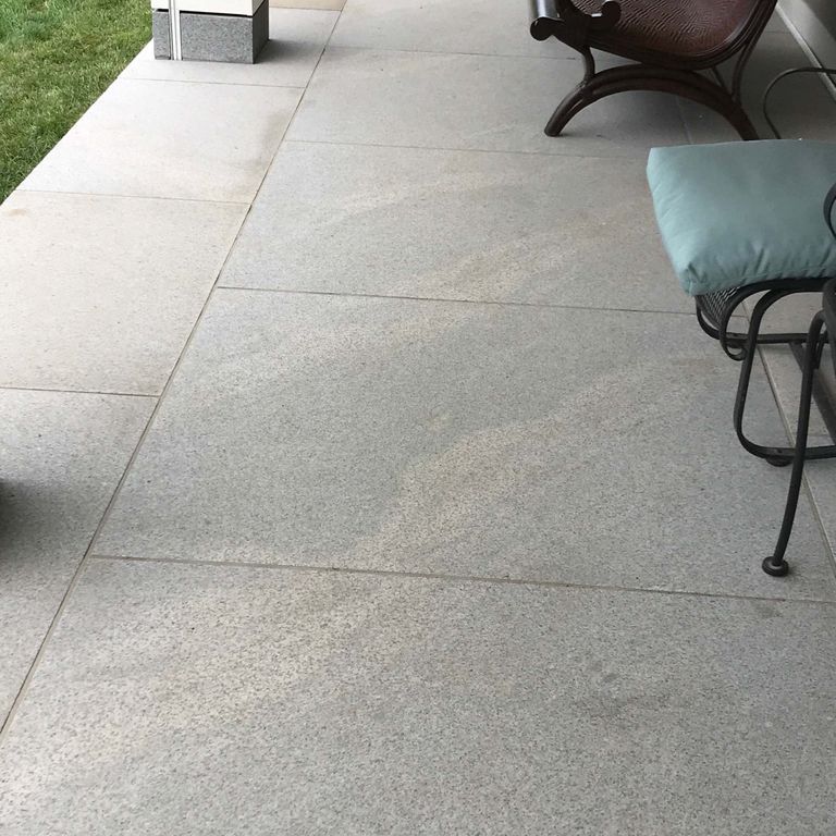 The image shows this product being used in a patio pavers application.