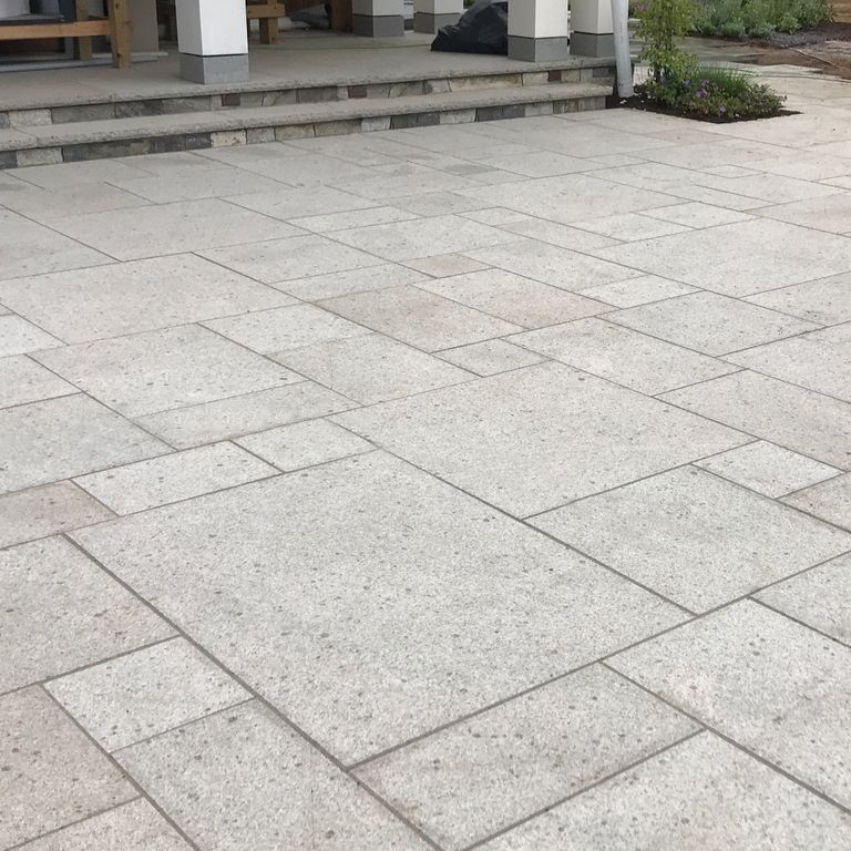 The image shows this product being used in a patio pavers application.