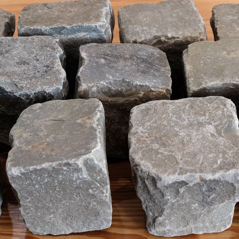 Application image for Reclaimed European Sandstone Cobblestones - Worn Cubes. The surface finish shown is . The dominant color shown is gray; with beige, black, brown, purple, white and tan secondaries. The color mix creates a warm feeling. Regular color pattern.